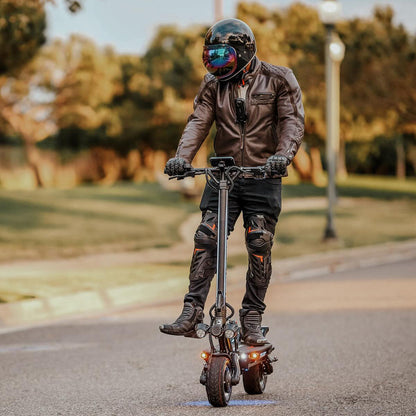 Dualtron Thunder 3 electric scooter with rider, featuring IPX5 waterproof rating and upgraded features.