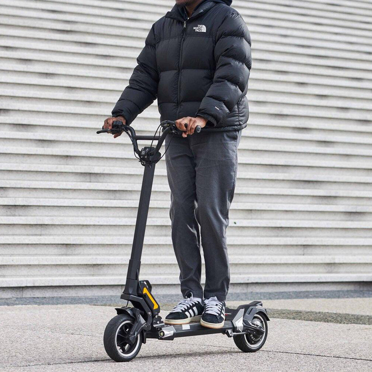 Sleek Dualtron Togo electric scooter for modern commuters outdoors.