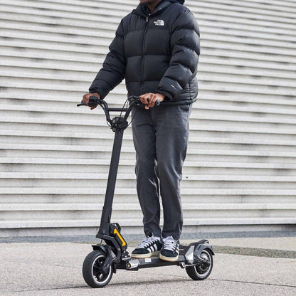 Sleek Dualtron Togo electric scooter for modern commuters outdoors.
